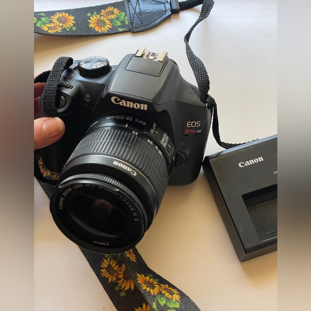 Canon EOS Rebel T6 Digital SLR camera with 2 batteries, a lens, and charger!